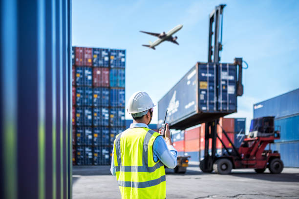 istock Foreman control loading Containers box to truck for Logistic Import Export Background, Business logistic concept, import and export concept 962603870