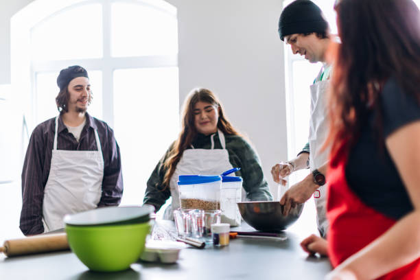 istock Group of young adults cooking in a community center workshop 962603936