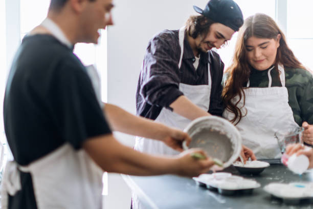 istock Group of people learning to cook in a community center workshop 962604122