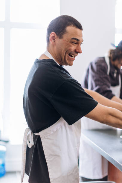 istock A young man participating at a cooking workshop in a community center 962604128