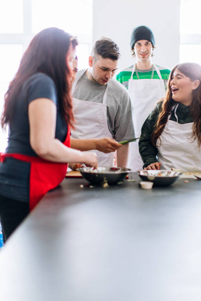 istock Community cooking workshop with a group of young adults 962604488