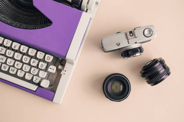 istock High angle view of typewriter and photography equipment 962606476