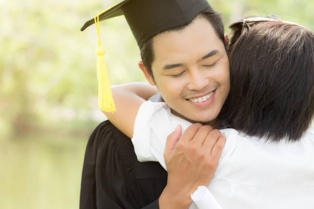 istock Happy Graduate hug celebrating with parent 962608000