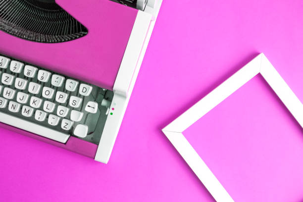 istock Flat lay of typing machine and blank photo frame. 962608908