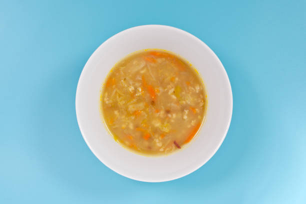 istock Soup with pasta and vegetables on a blue 962609598