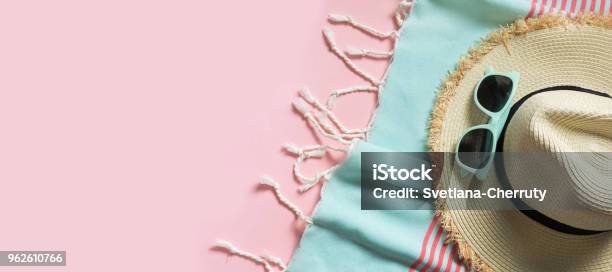 Straw Beach Sunhat And Sun Glasses On Punchy Pink With Space For Text Female Outfit For Beach Summer Concept Stock Photo - Download Image Now