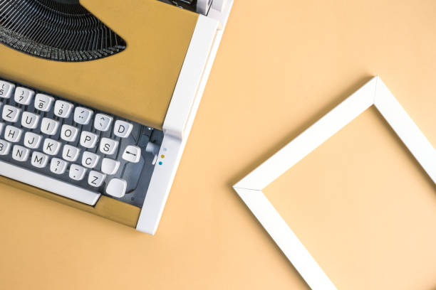 istock Flat lay of typing machine and blank photo frame. 962611298