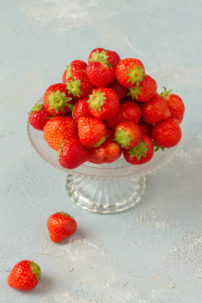 istock Fresh strawberries on a glas plate, plateau. Isolated. 962614546