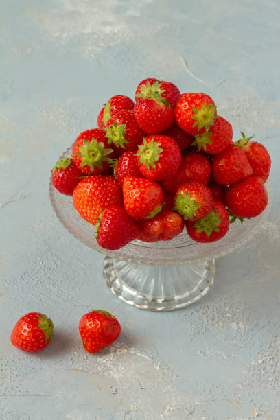 istock Fresh strawberries on a glas plate, plateau. Isolated. 962614684