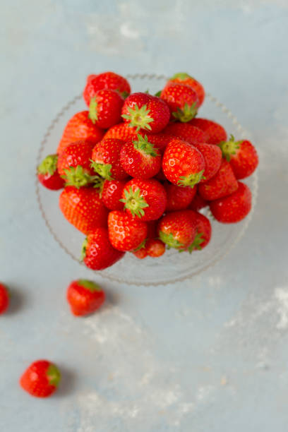istock Fresh strawberries on a glas plate, plateau. Isolated. 962614780