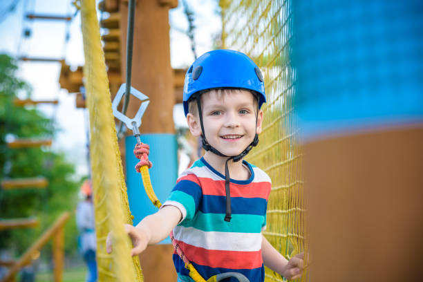 istock Young boy playing and having fun doing activities outdoors. Happiness and happy childhood concept 962615346