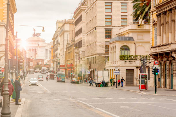 Rome, Italy, March 2017: view of Via Nazionale in Rome with the monument of the Fatherland in the background at sunset