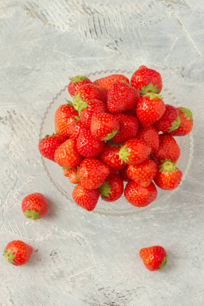 istock Fresh strawberries on a glas plate, plateau. Isolated. 962615460