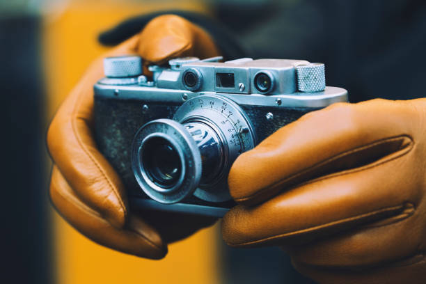 istock Hands holding a vintage photo camera 962616212