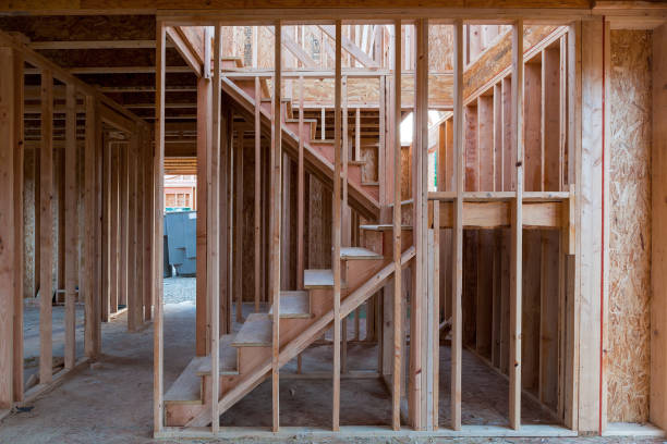 istock New home construction interior wood stud framing ceiling beams entryway staircase 962618822