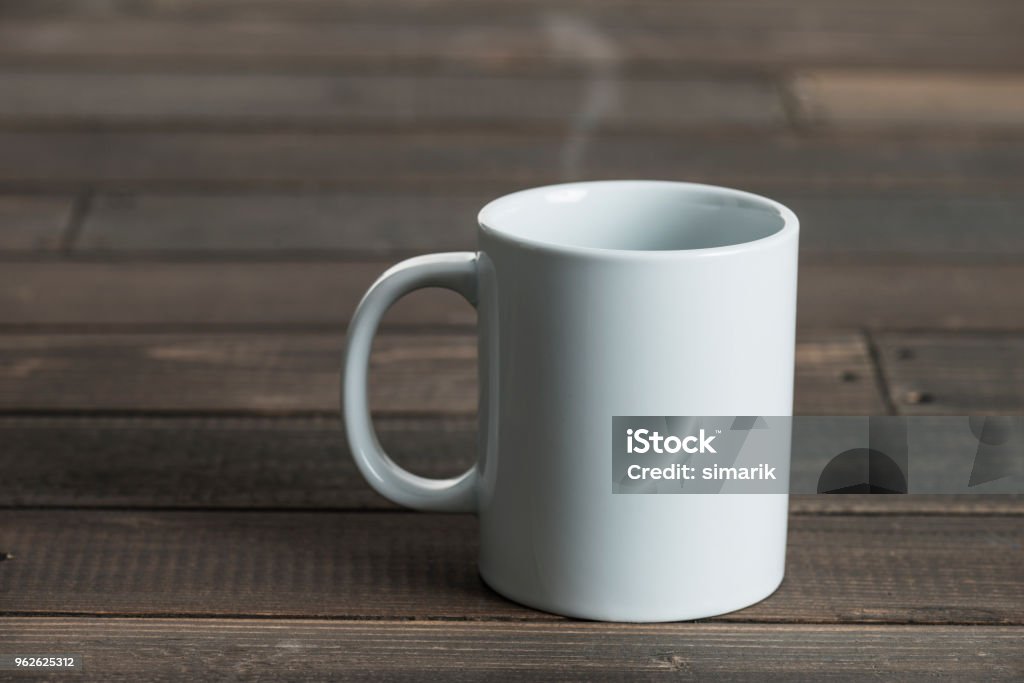 Coffee Mug White coffee mug on wooden background. Mug Stock Photo