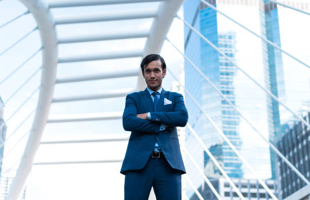 istock Smart young business man on building background. Image selected clipping path. 962630020