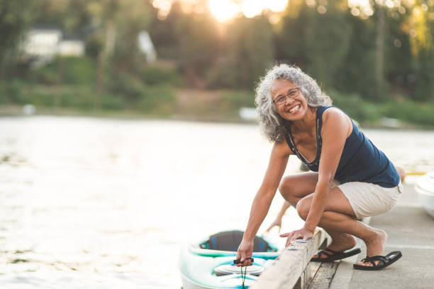 istock A beautiful older woman prepares to go kayaking 962631998