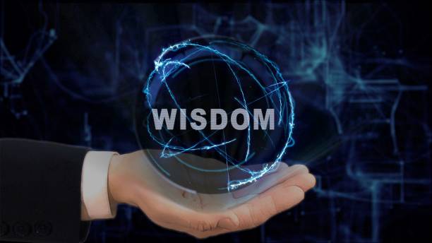 istock Painted hand shows concept hologram Wisdom on his hand 962633134