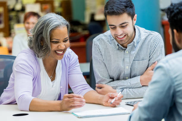 istock Senior woman studies with university classmates 962638124