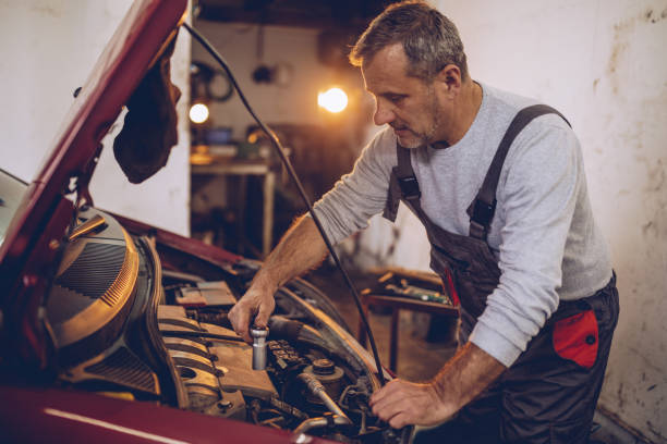 istock Senior car mechanic working in garage 962641418