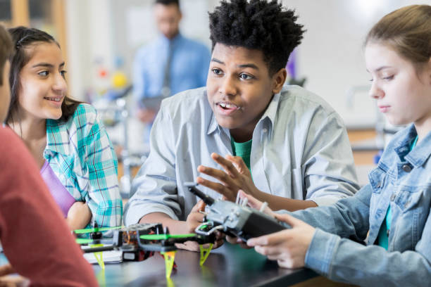 istock Teenage students build drone during technology class 962641524