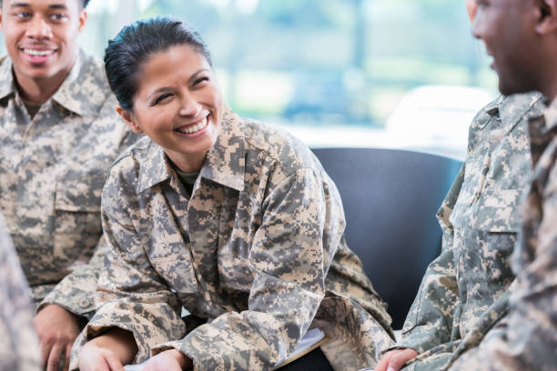 istock Cheerful female soldier participates in group therapy session 962642230
