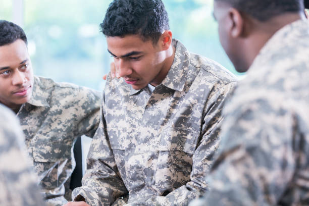 istock Soldiers pray for fellow soldier 962642244