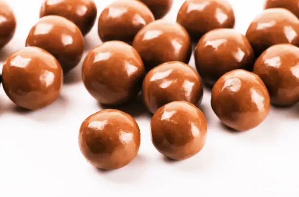 Chocolate balls on a white background close-up