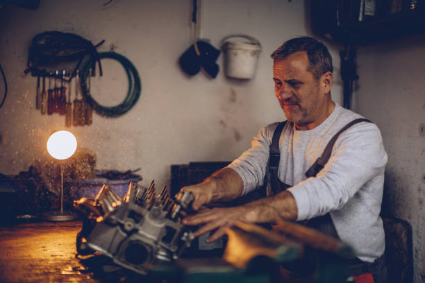 istock Mechanic repairing auto engine in garage 962643784