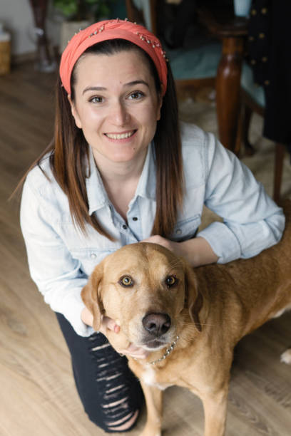 istock Young woman with labrador 962644382