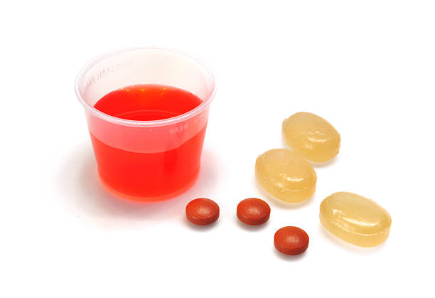 Close up of half full red water bottle