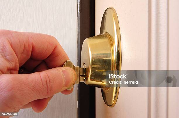 Locking A Deadbolt Stock Photo - Download Image Now - Front Door, Locking, Unlocking