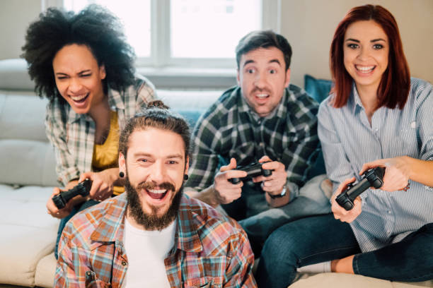 istock Happy bearded man playing video games 962646428