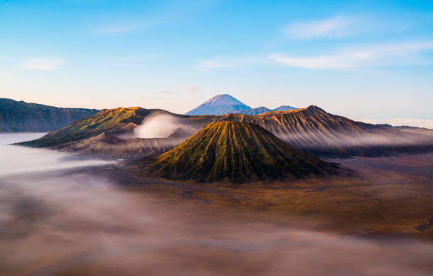 istock Mount Bromo with mist and fog during sunrise 962646456
