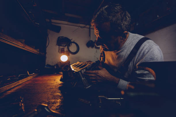 istock Mechanic repairing car engine in workshop 962648548
