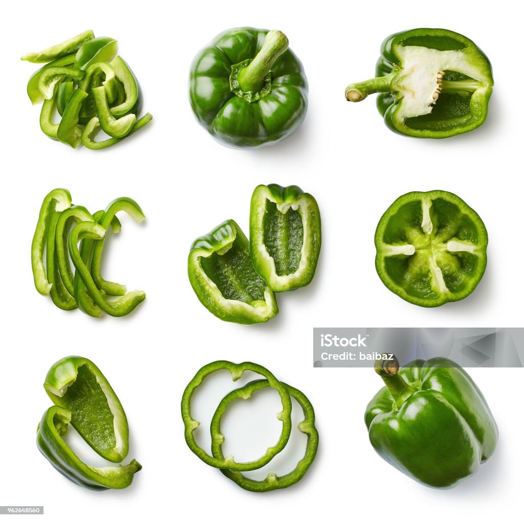 Set of fresh whole and sliced sweet pepper Set of fresh whole and sliced sweet green pepper isolated on white background. Top view Green Bell Pepper Stock Photo