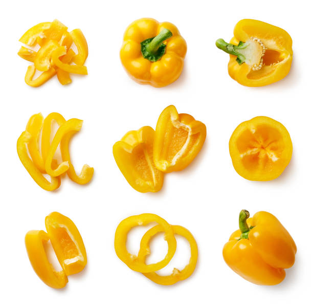 набор свежего цельного и нарезанного сладкого перца - yellow bell pepper стоковые фото и изображения