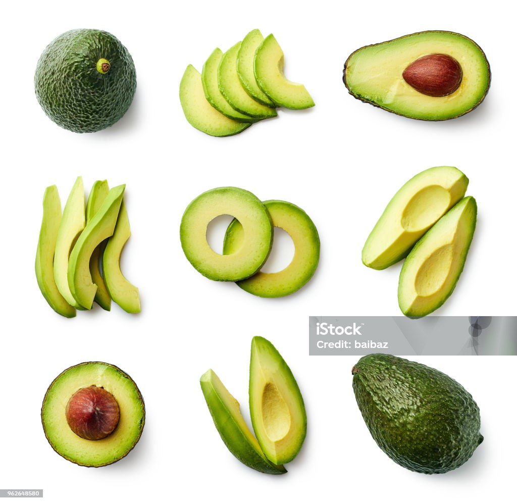 Set of fresh whole and sliced avocado Set of fresh whole and sliced avocado isolated on white background. Top view Avocado Stock Photo