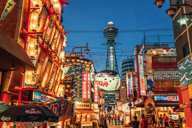 Osaka Tower and view of the neon advertisements Shinsekai district