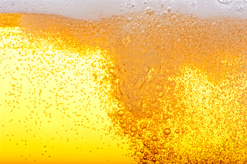 Beer bubbles in the high magnification and close-up.