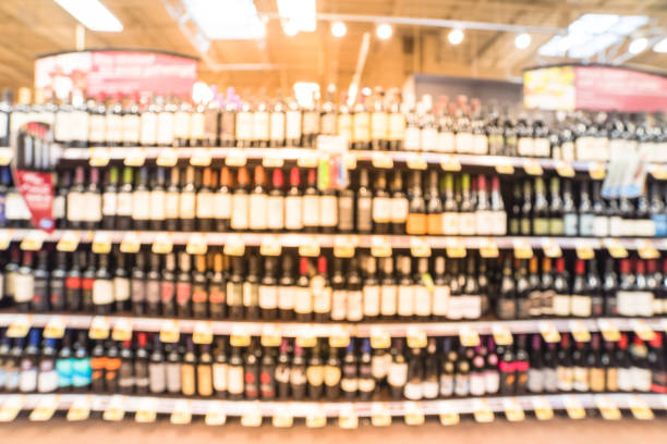 istock Abstract blurred wine shelves with price tags at store in USA 962654870