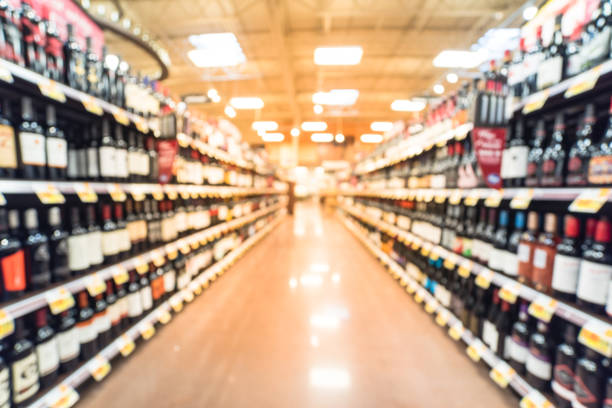 istock Abstract blurred wine shelves with price tags at store in USA 962655828