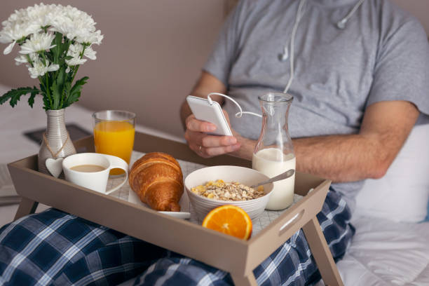 istock Man listening to music in bed 962664402