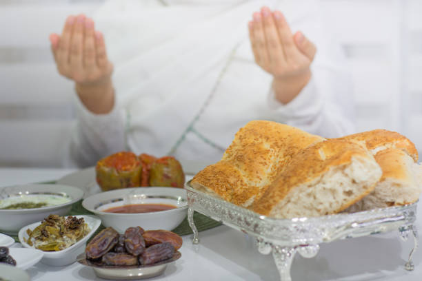 istock ramadan and praying woman 962665378