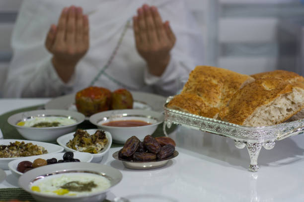 istock ramadan and praying woman 962665770