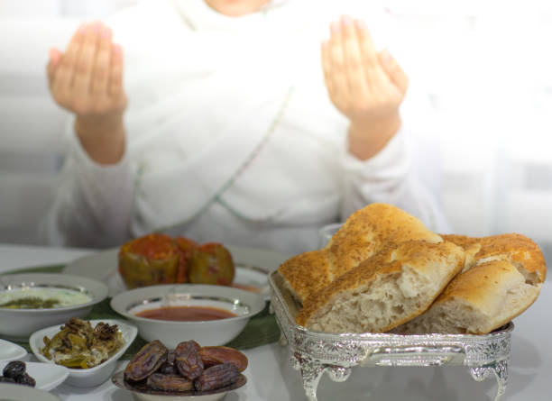 istock ramadan and praying woman 962666372