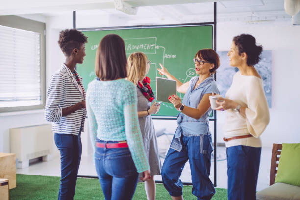 istock Businesswomen working together 962668476