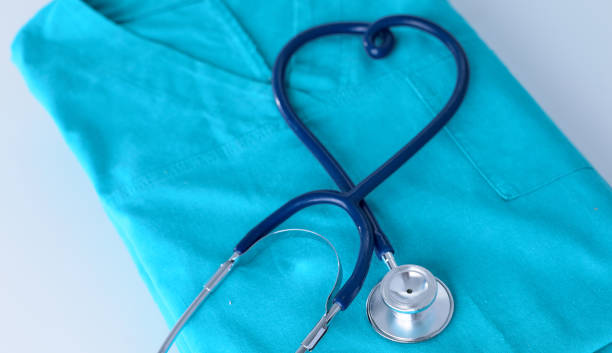 istock A stethoscope shaping a heart on a medical uniform, closeup, selective focus 962678548