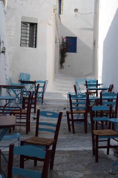 istock Greek street with chairs 962678838